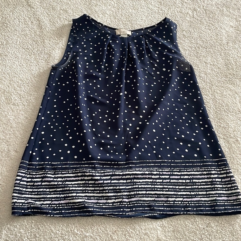 Lightweight navy top with white polka dots and lilac accent on the bottom